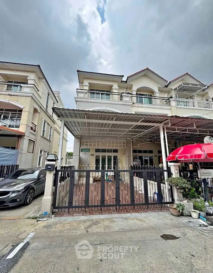 Charming townhouse with gated entrance and covered parking in a serene neighborhood.