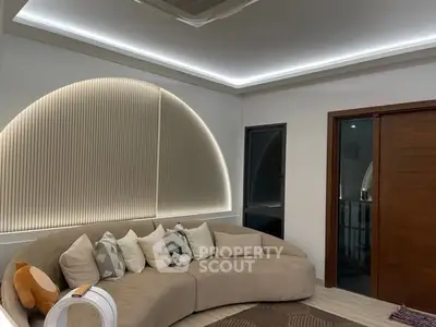 Modern living room with stylish curved sofa and ambient lighting