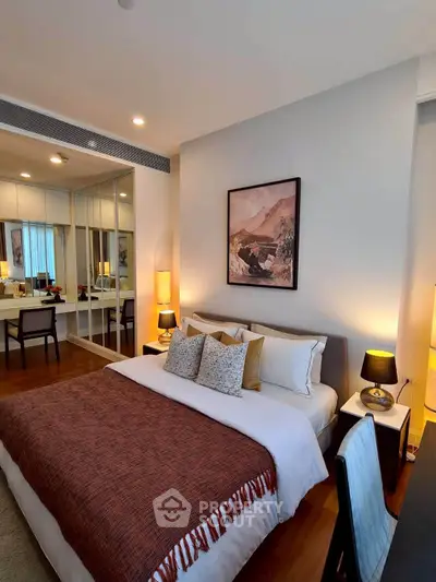 Luxurious bedroom with elegant decor and cozy ambiance, featuring a stylish bed and modern furnishings.
