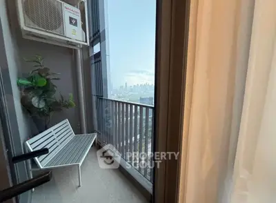 Chic urban balcony with city skyline view, perfect for relaxation and enjoying the outdoors.
