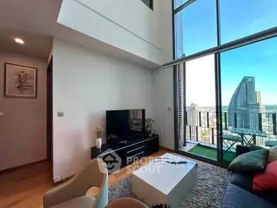 Modern living room with floor-to-ceiling windows and stunning city view