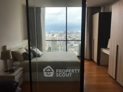Spacious bedroom with stunning city view and modern furnishings
