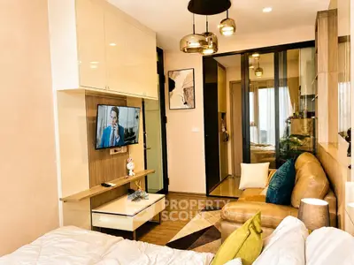Modern living room with stylish decor and cozy ambiance in a contemporary apartment.
