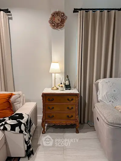 Cozy living room with elegant furniture and soft lighting, perfect for relaxation and comfort.