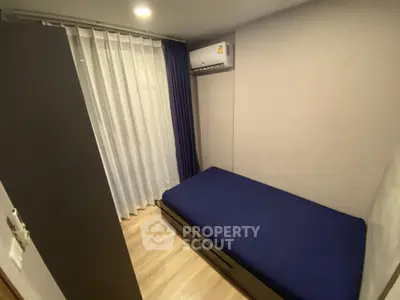 Cozy small bedroom with modern air conditioning and sleek design