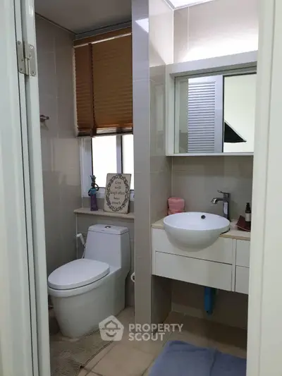 Modern bathroom with sleek fixtures and stylish decor in a contemporary home.