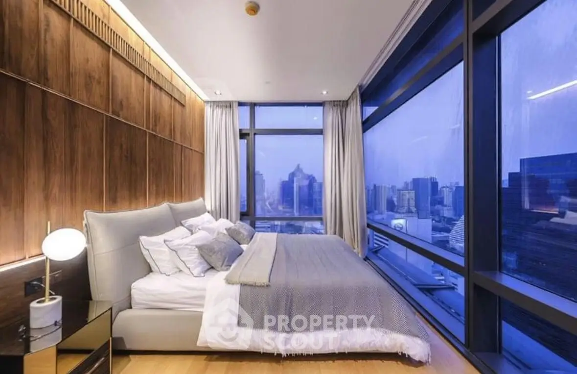 Luxurious bedroom with panoramic city view and modern decor