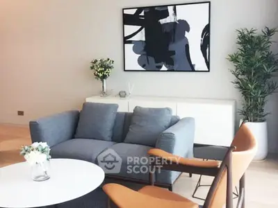 Stylish modern living room with cozy sofa and abstract art