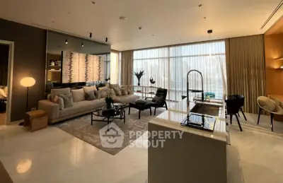 Luxurious open-plan living room with modern kitchen and elegant decor