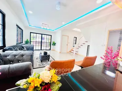 Spacious modern living room with stylish furniture and bright natural light.