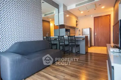 Modern living room with stylish decor and open kitchen layout