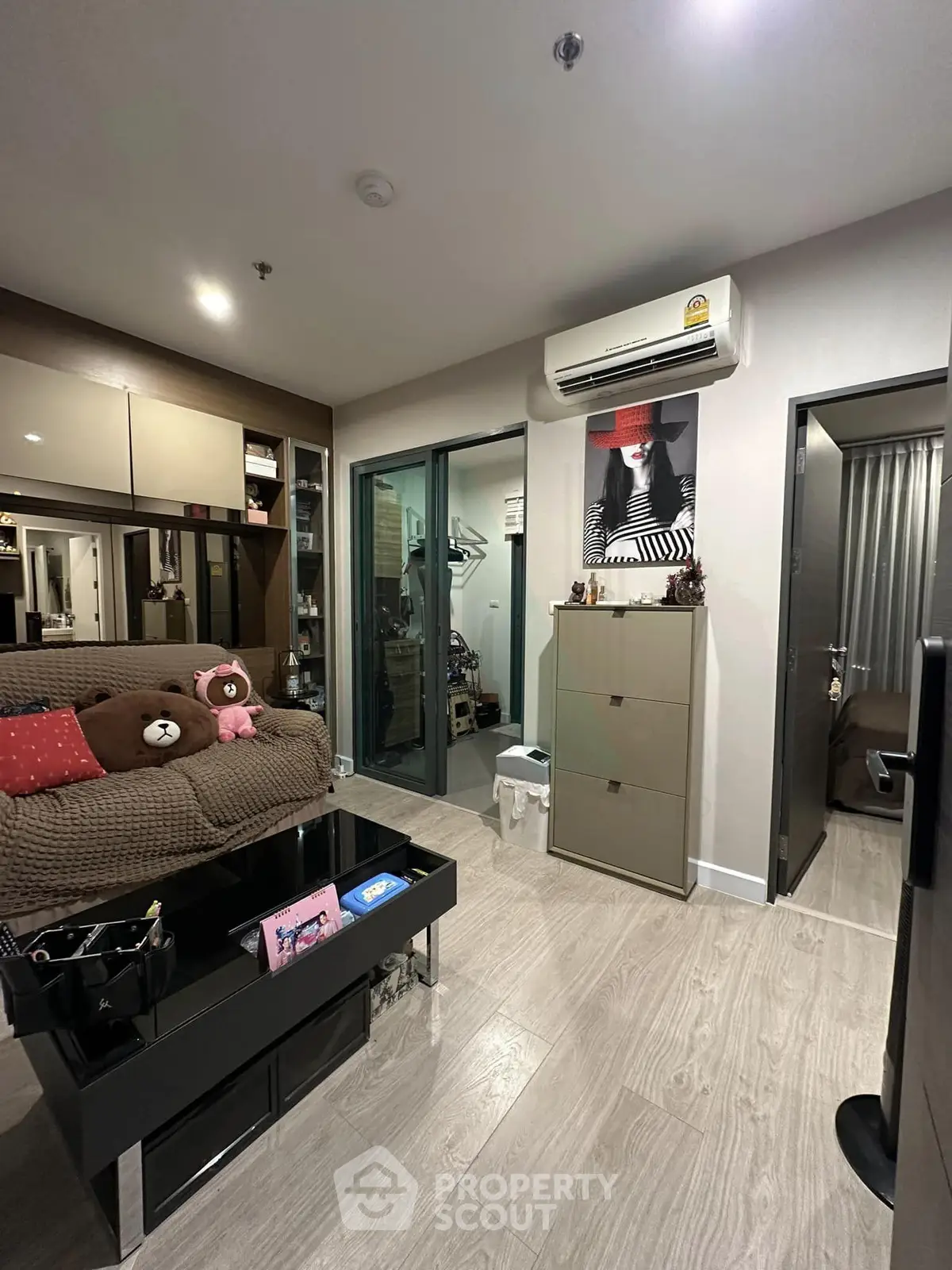 Modern living room with stylish decor and air conditioning in a cozy apartment.