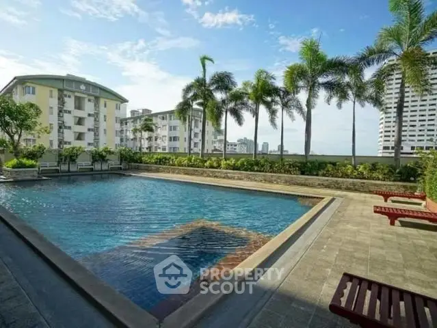 Luxurious rooftop pool with stunning city views and palm trees.