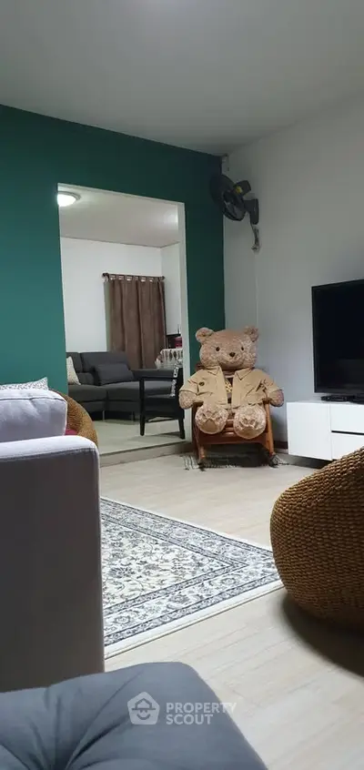 Cozy living room with plush teddy bear and modern decor