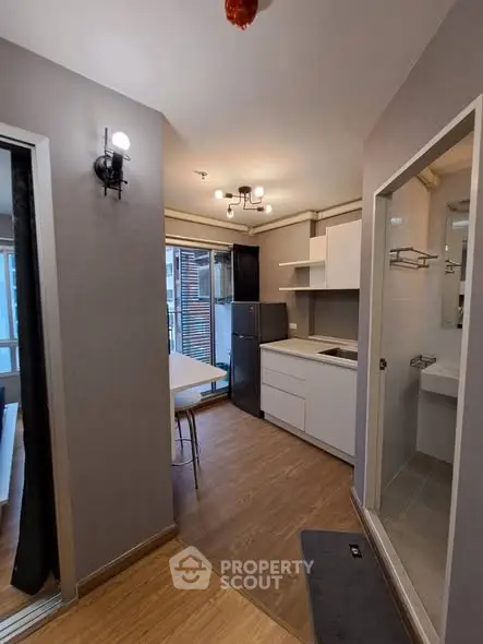 Modern compact apartment with open kitchen and cozy dining area