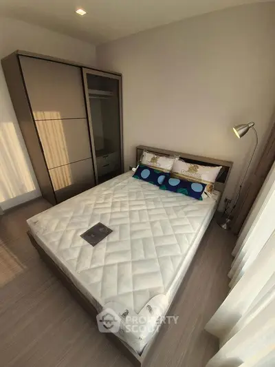 Modern bedroom with stylish decor and ample natural light
