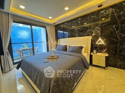 Luxurious bedroom with modern decor and balcony access