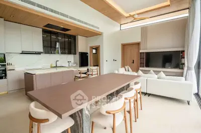 Modern open-plan living room with sleek kitchen and stylish dining area