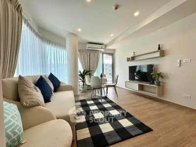 Spacious modern living room with elegant decor and natural light