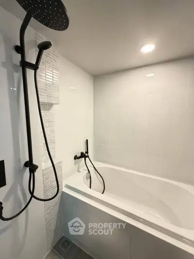 Modern bathroom with sleek bathtub and rainfall showerhead