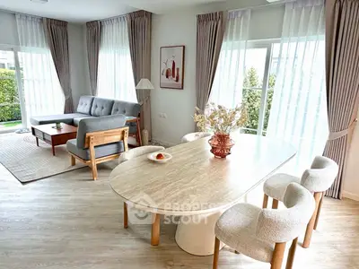 Spacious modern living room with elegant dining area and large windows