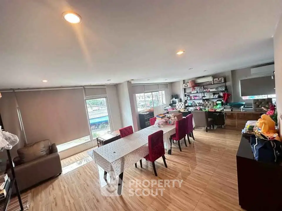 Spacious living room with modern decor and ample natural light