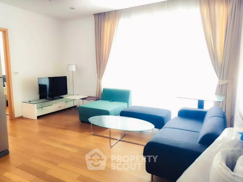 Spacious modern living room with stylish furniture and natural light