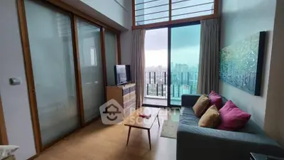 Modern living room with city view, featuring stylish decor and floor-to-ceiling windows.