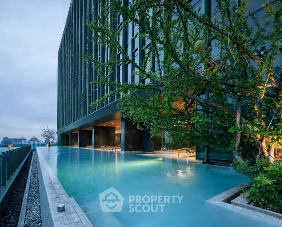 Luxurious rooftop infinity pool with stunning cityscape views at modern high-rise building.