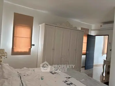 Elegant bedroom with classic wardrobe and soft lighting