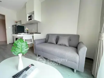 Modern living room with sleek gray sofa and stylish decor