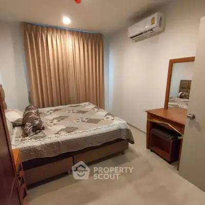 Cozy bedroom with air conditioning and elegant decor in modern apartment.