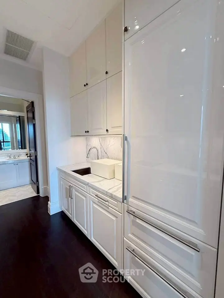 Sleek modern kitchen with high-end appliances and elegant cabinetry, perfect for culinary enthusiasts.