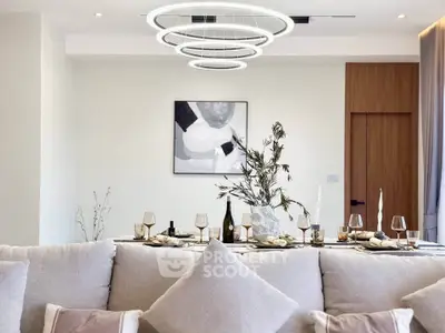 Luxurious modern living room with elegant dining setup and stylish lighting