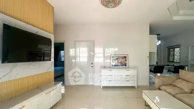 Modern living room with sleek TV setup and elegant decor