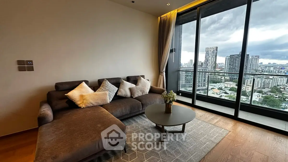 Luxurious living room with stunning city view from high-rise balcony