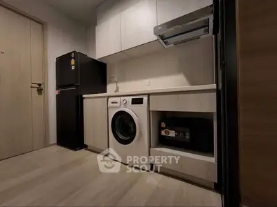 Modern kitchen with sleek appliances and ample storage space