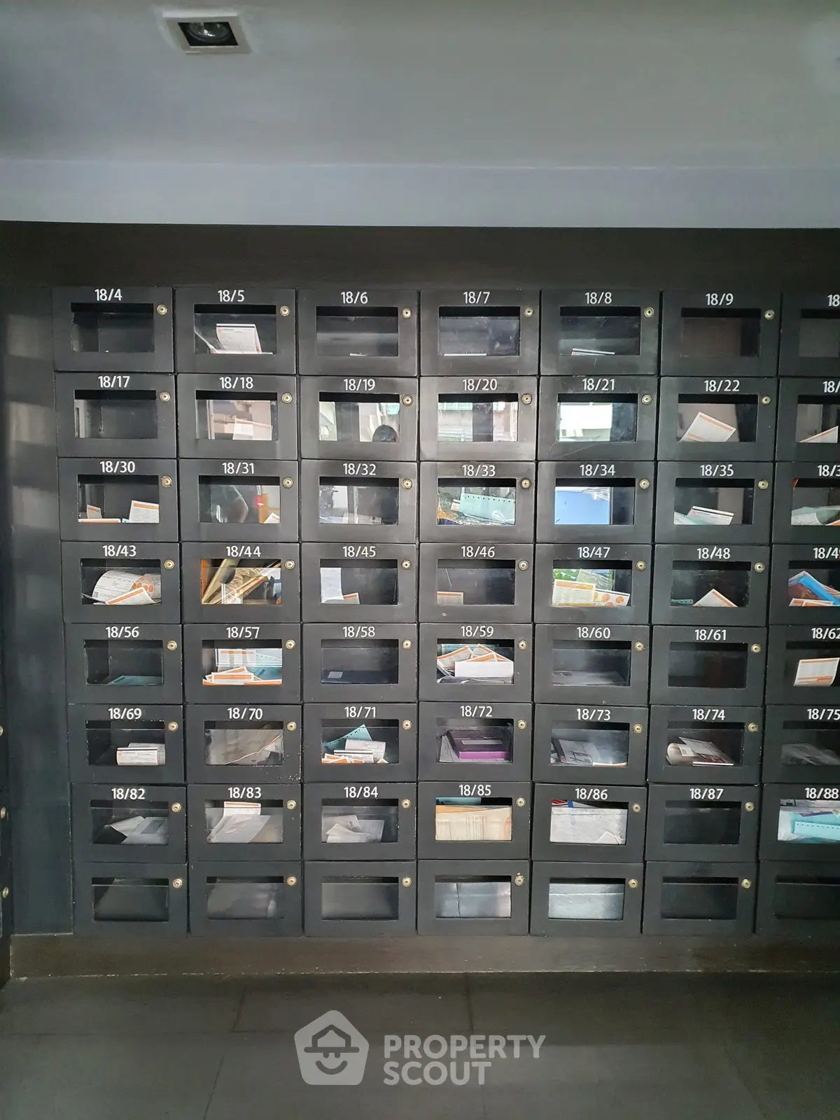 Modern apartment building mailboxes with sleek design and organized layout