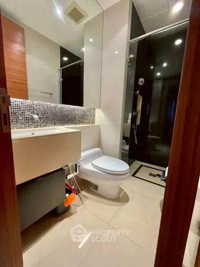 Modern bathroom with sleek design and glass shower enclosure