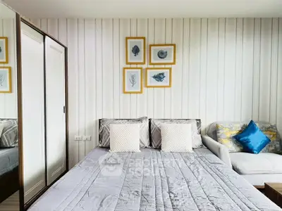 Stylish bedroom with modern decor and cozy seating area