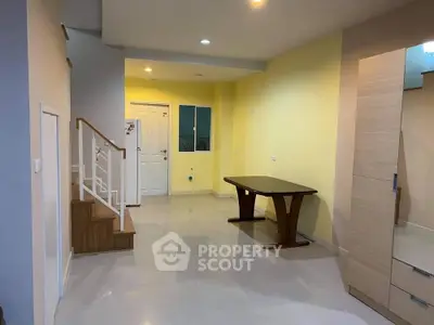 Spacious interior with modern staircase and elegant dining table