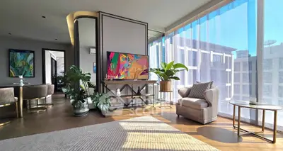 Luxurious modern living room with floor-to-ceiling windows and stylish decor
