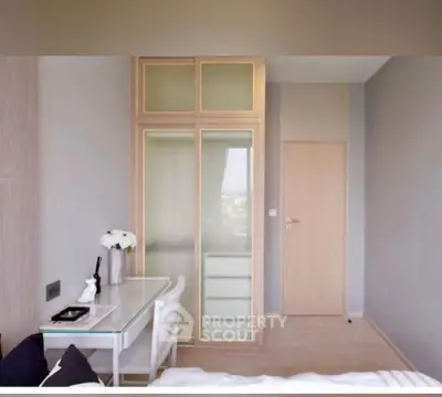 Modern bedroom with sleek furniture and ample natural light