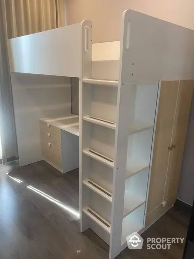 Modern loft bed with integrated desk and storage in a stylish bedroom