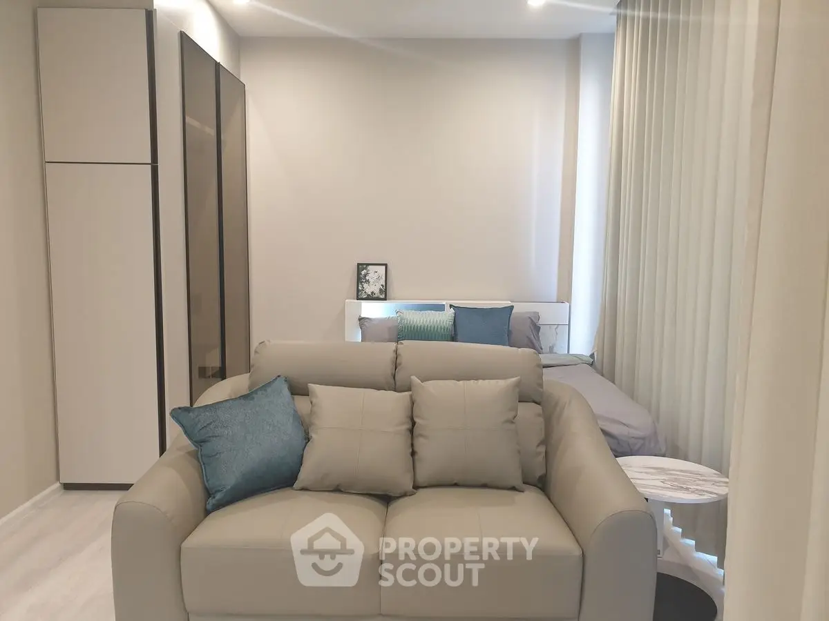 Modern studio apartment with cozy living area and stylish decor