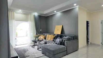 Modern living room with stylish gray sectional sofa and elegant decor