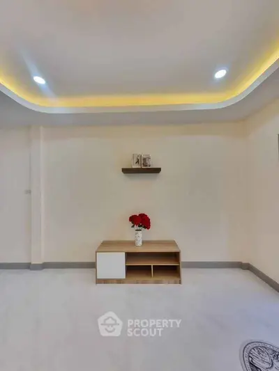 Modern living room with minimalist decor and ambient lighting