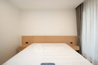 Modern minimalist bedroom with natural light and elegant curtains