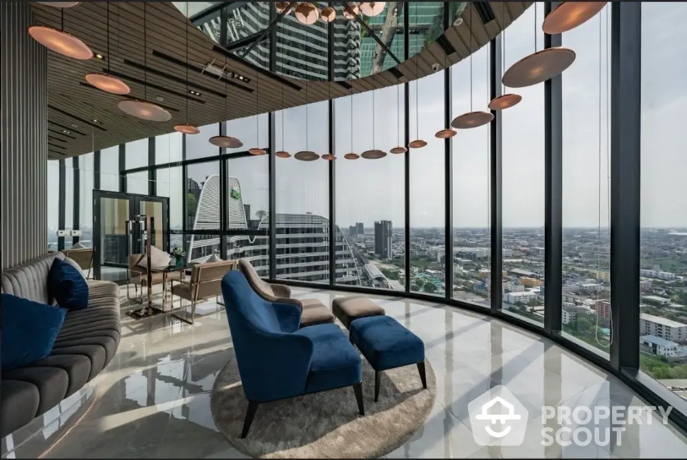 Luxurious high-rise living room with panoramic city views and modern furnishings