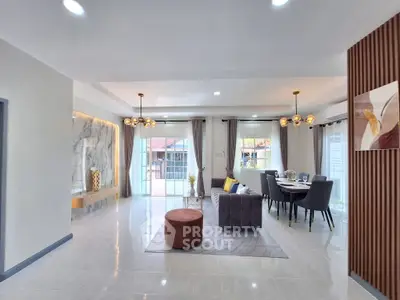 Spacious modern living room with elegant dining area and stylish decor